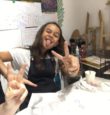 Fine momentum art class student enjoying art class