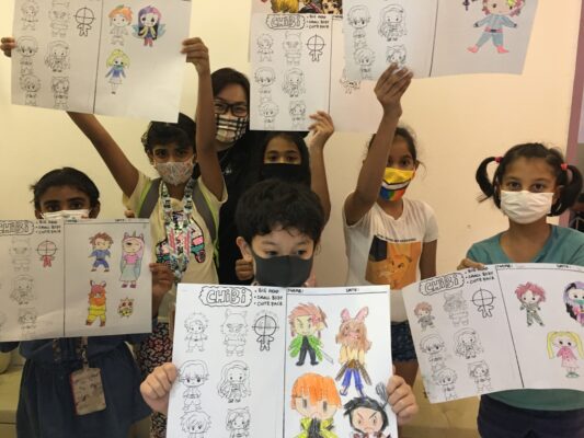 Fine momentum art class students showcasing their artworks with instructor
