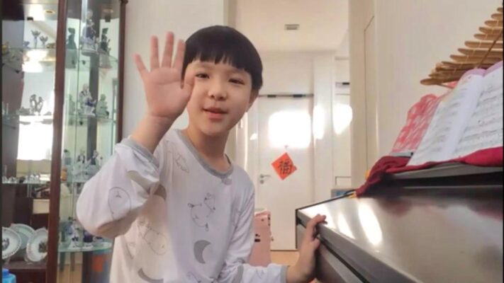 Fine momentum online music piano lesson student enjoying