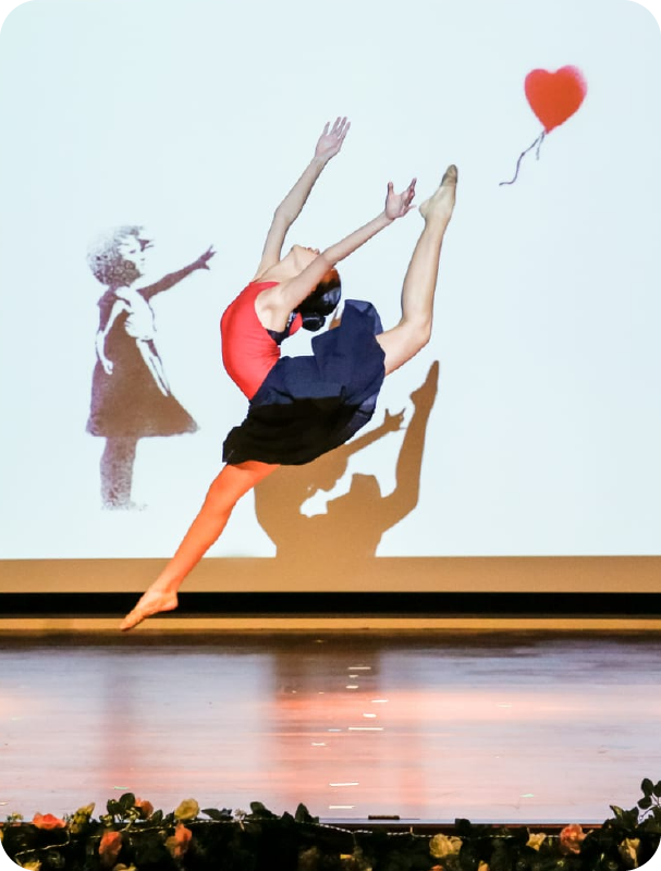 Fine momentum ballet classes student performing ballet on stage