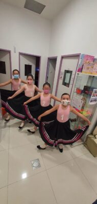 Fine momentum ballet classes for kids students doing ballet poses
