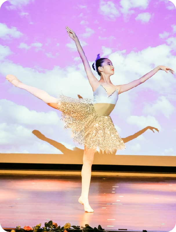 Fine momentum ballet classes student performing ballet on stage